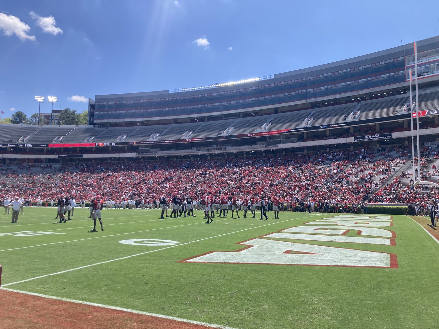 Georgia players on the field at Sanford Stadium during the 2025 G-Day spring game, stands full behind them.